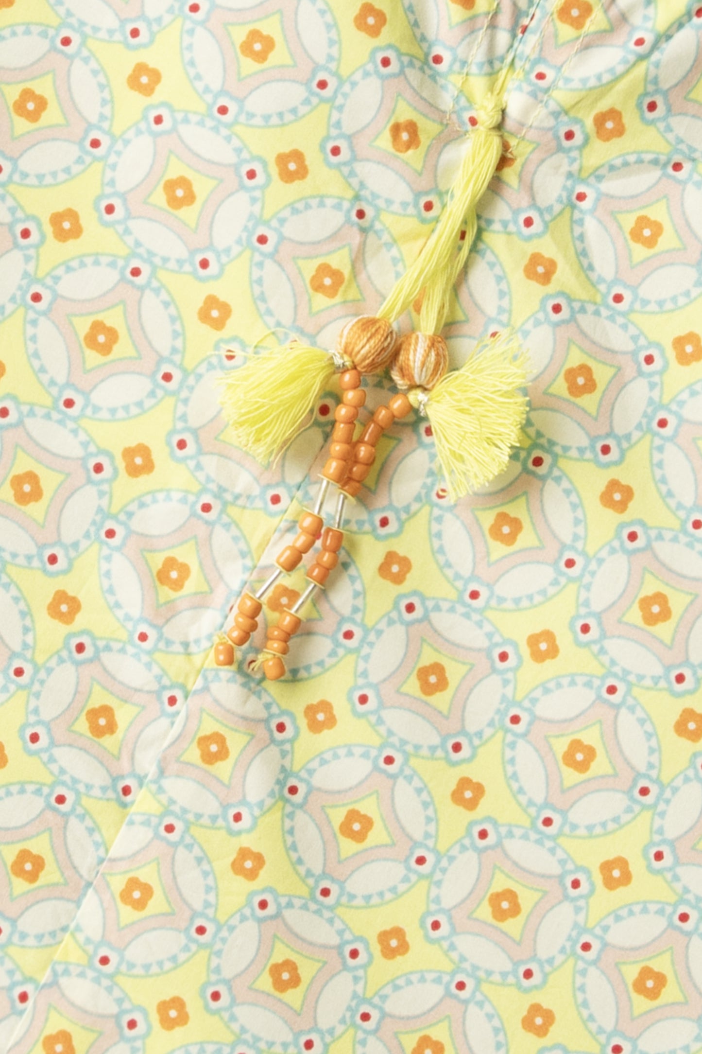 Sunlit Lattice Tassel Top